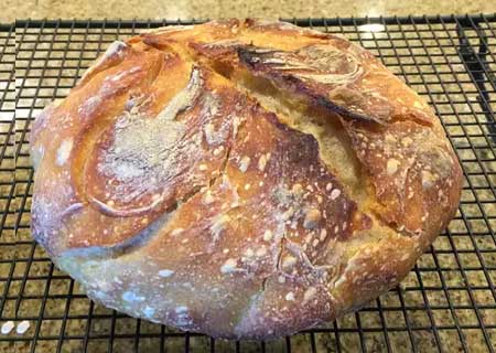 A photo of a loaf of soughdough bread.